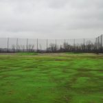 Completed driving range barrier net installation