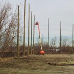 Wood support pole installation