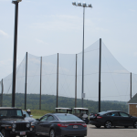 Steel Pole supported Golf Range Netting Installation with guy wires and cabling