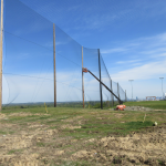 Installing golf netting panels for driving range