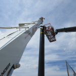 Installing Steel Poles for supporting the Golf Barrier Netting