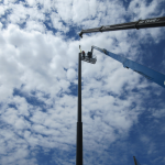Completing the steel pole installation for the driving range
