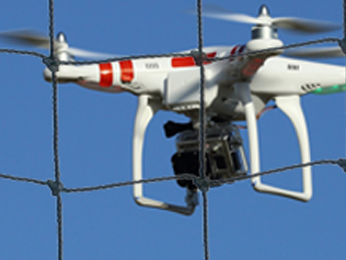 Drone flying behind drone netting