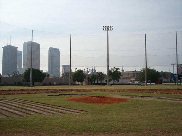 Baseball field with baseball barrier netting surrounding it