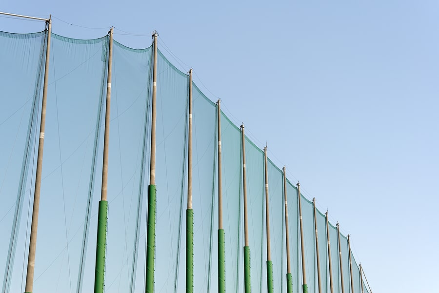 Zoomed In View: Green and yellow netting poles
