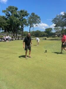 Celebrity Golf Pro Lining Up Putt